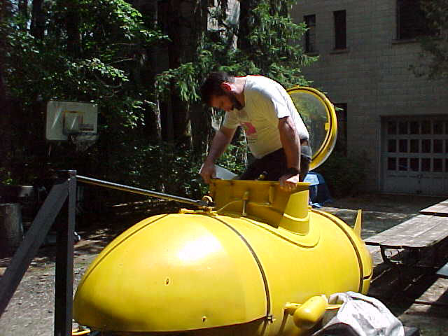 Don climbing into the sub